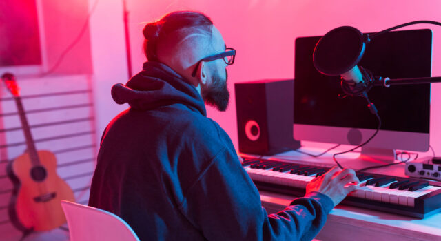 Musician and making music concept - Male sound producer working in recording studio